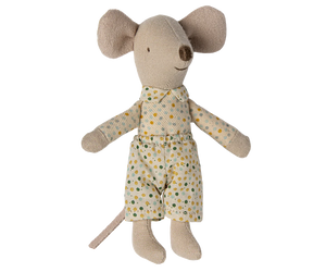 Stuffed toy mouse wearing a polka dot outfit on a white background
