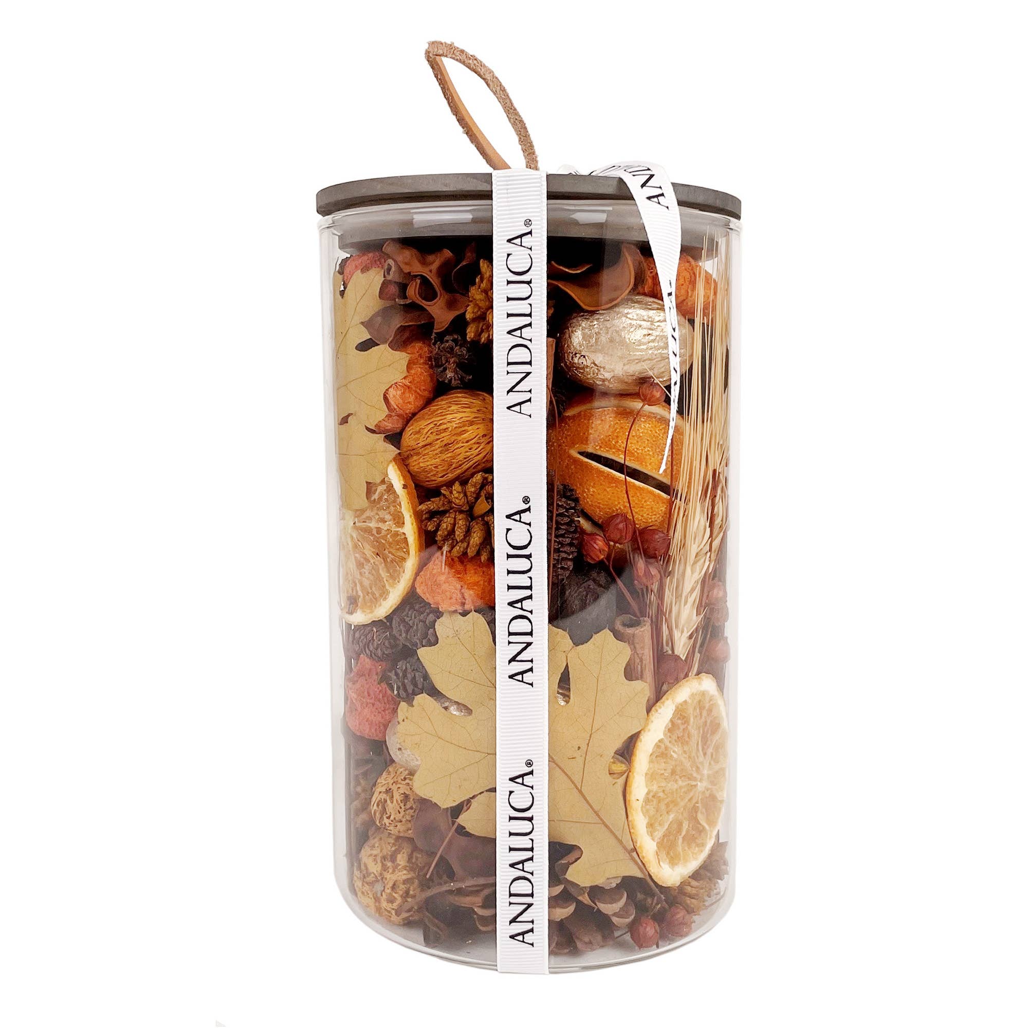 A transparent container filled with dried fruits, spices, and herbs with a brand name on a white background.
