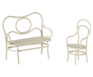 White metal bench and chair set on a white background