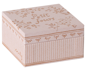 Decorative box with floral patterns and 'Petit fours' text on a white background