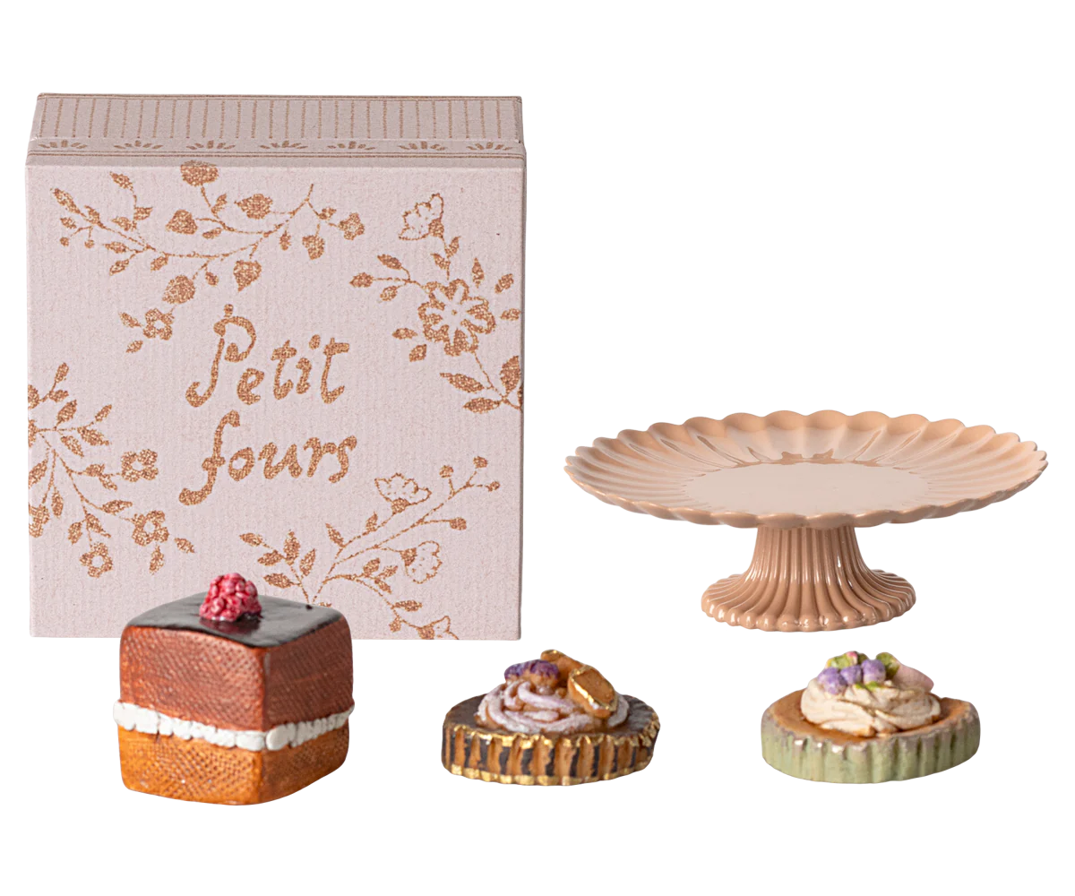 Miniature pastries and cake stand with decorative box.
