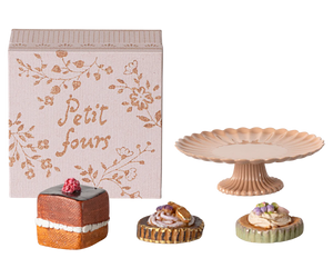 Miniature pastries and cake stand with decorative box.
