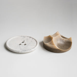 A cardamom vetiver architectural soap and marble bouton, made by hand by UME studios