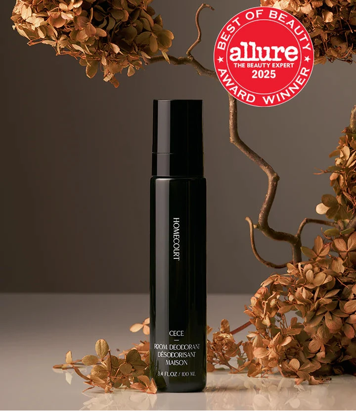 Black deodorant bottle with 'allure Best of Beauty Award Winner' badge on a dark background with decorative elements.