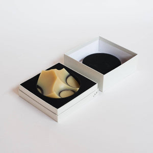 An UME Studios cedar sandalwood soap, in a light grey box