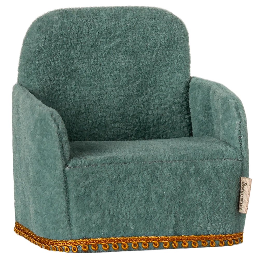 A small, mint-colored folding chair with a gold-colored trim, designed for small toy figures.