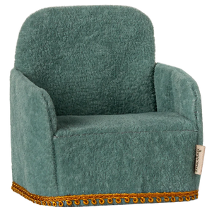 A small, mint-colored folding chair with a gold-colored trim, designed for small toy figures.