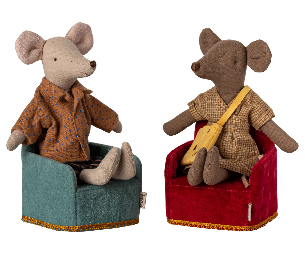 A small, mint-colored folding chair with a gold-colored trim, designed for small toy figures.