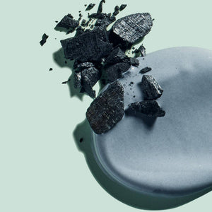 Bits of charcoal mixed in with a sample of David's charcoal toothpaste. 