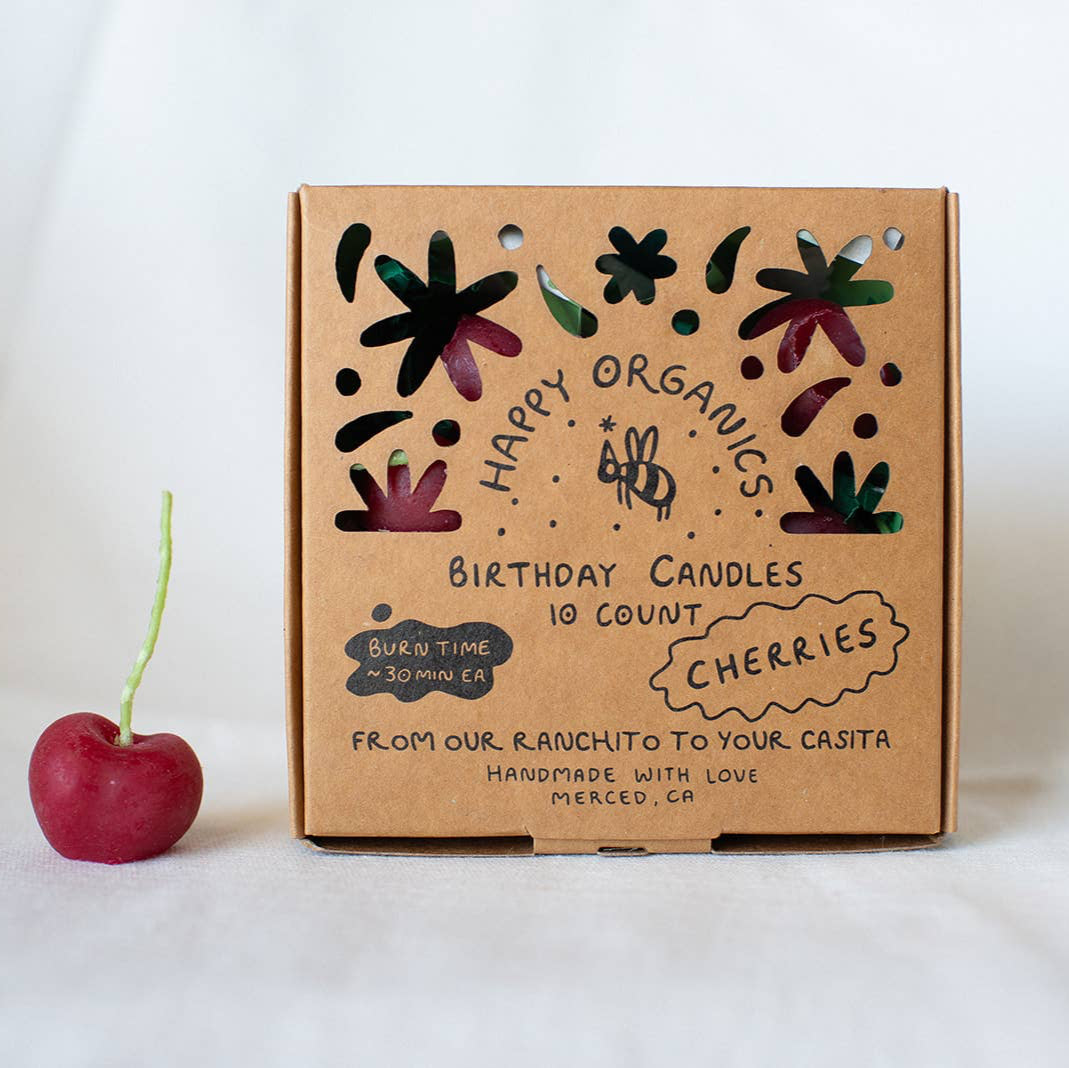 A box of organic cherry candles, made in California by Happy Organics