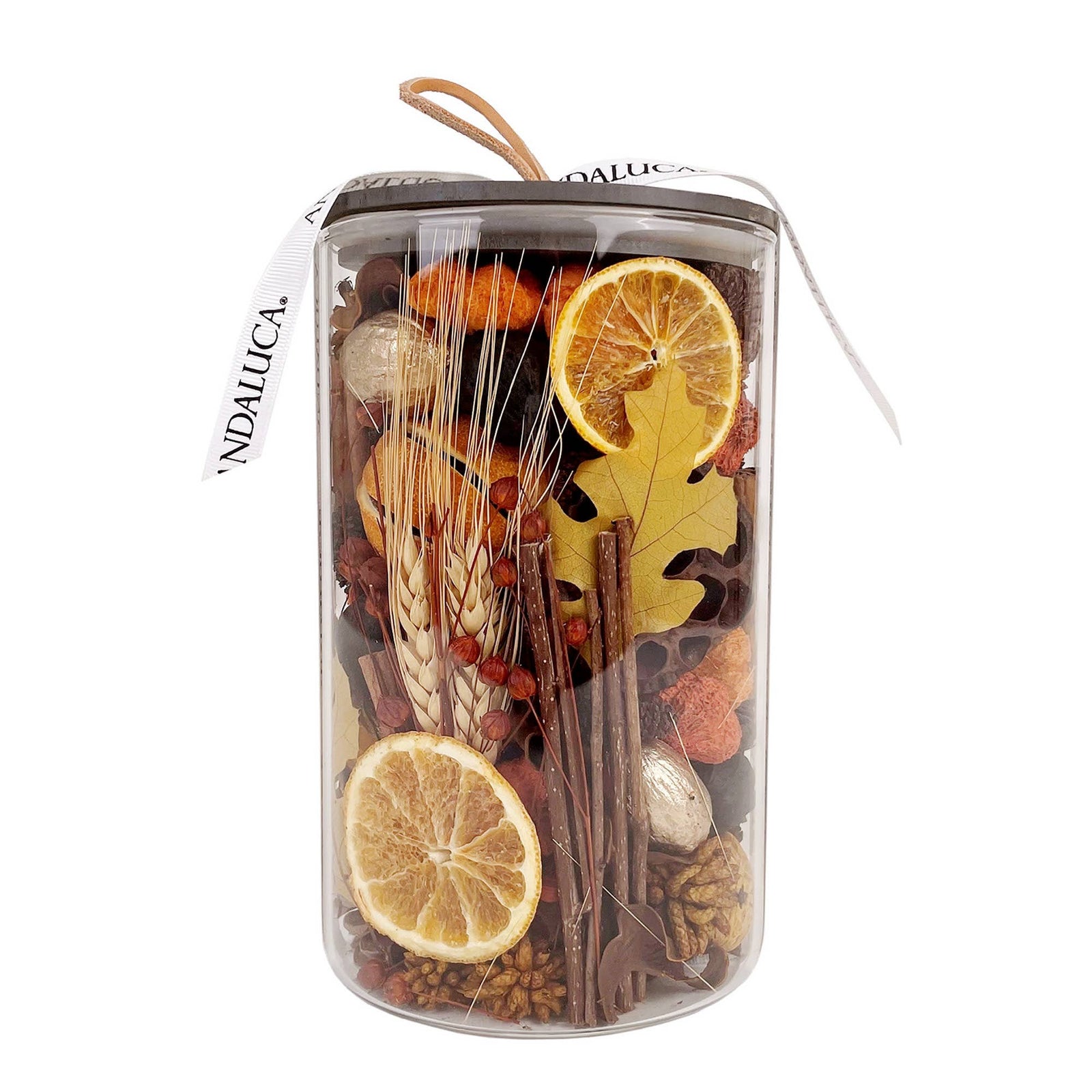 A transparent container filled with dried fruits, spices, and herbs with a brand name on a white background.