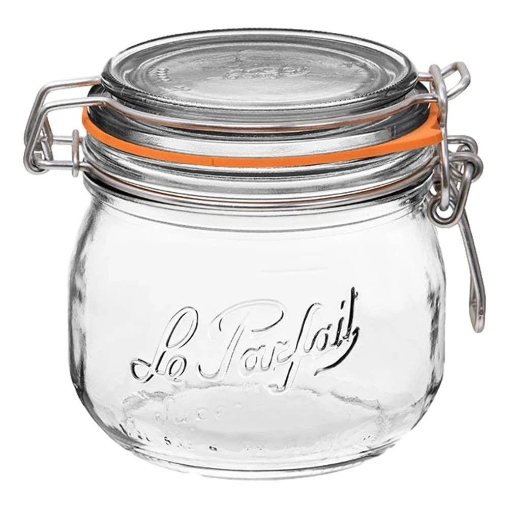 A clear glass Le Parfait rounded storage jar with an orange lid and a stainless steel wire clamp.