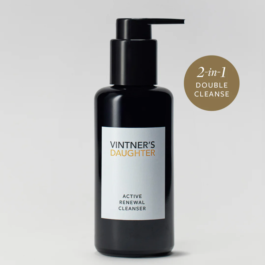 A pump bottle of Vintner's Daughter Active Renewal Cleanser, with a label that reads 'ACTIVE RENEWAL CLEANSER' and indicates a 'DOUBLE CLEANSE' process. The background is white and clean.