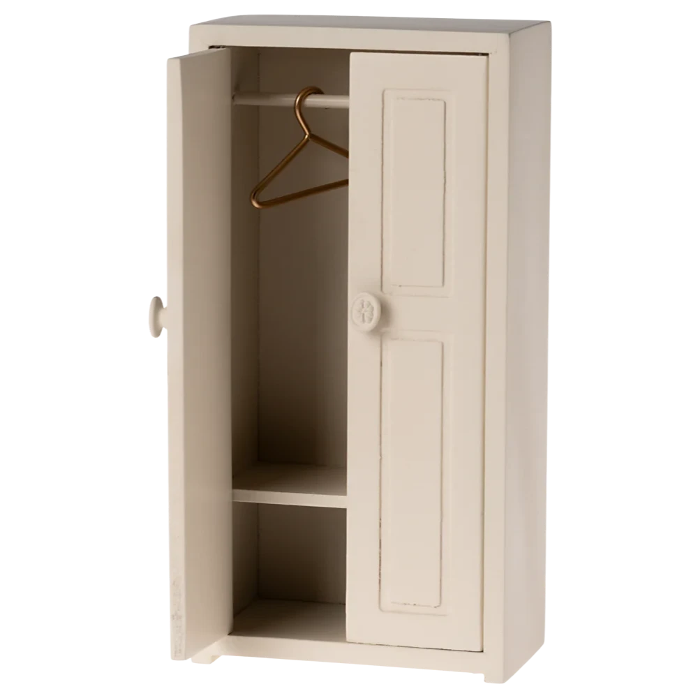 Beige cabinet with a hanger inside on a white background