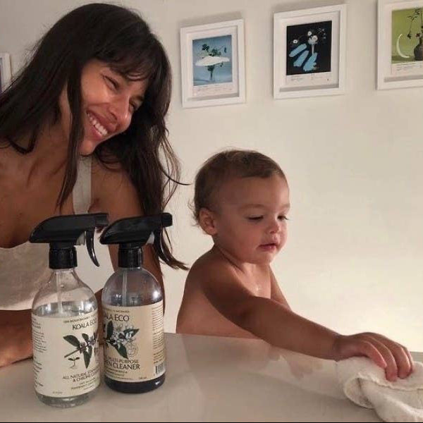 A woman and a toddler cleaning with the organic cleaning cloth