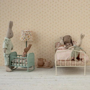 Children's room with toy rabbits in a bedroom setting.