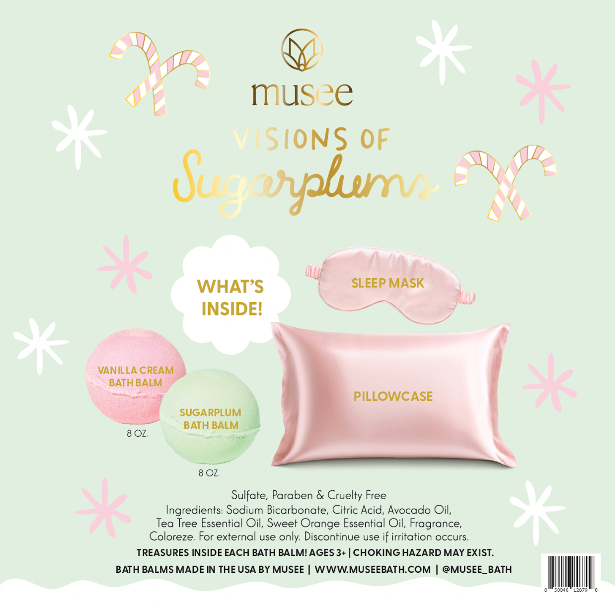 Pink satin eye mask, bath bombs, and 'Visions of Sugarplums' packaging on a white background