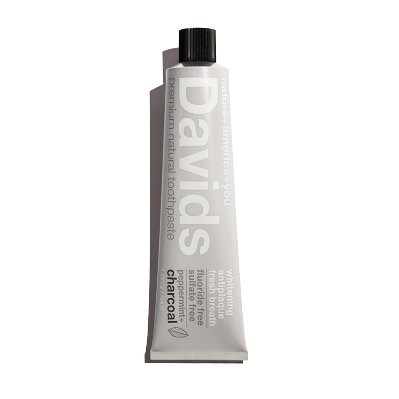A tube of Davids Premium Natural Toothpaste with Charcoal and Peppermint flavor.