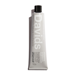 A tube of Davids Premium Natural Toothpaste with Charcoal and Peppermint flavor.