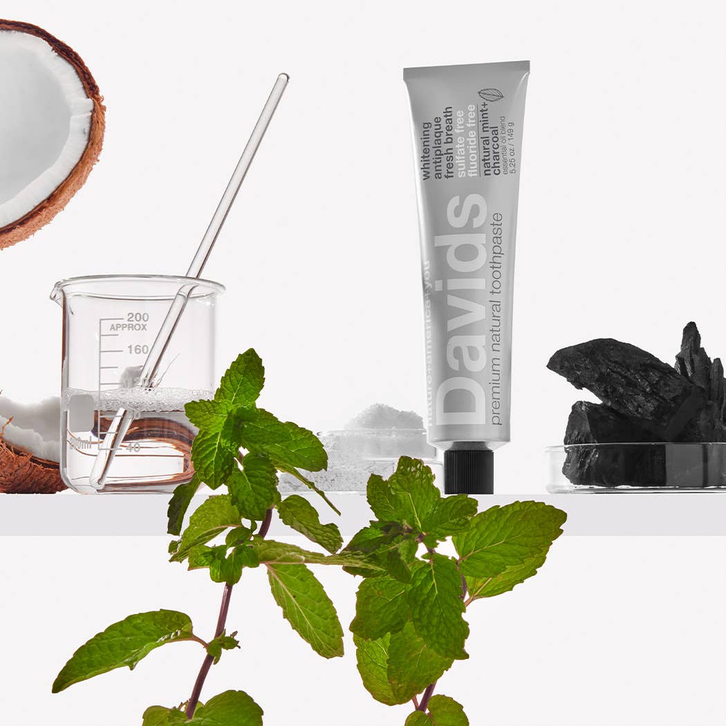 A tube of Davids toothpaste with coconut, mint and charcoal.