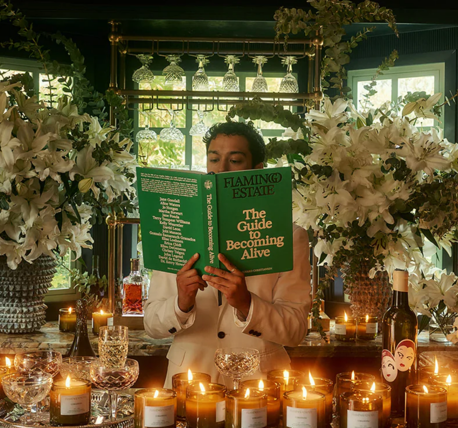 A green book titled 'The Guide to Becoming Alive' by Flamingo Estate with author's name Richard Christensen at the bottom.