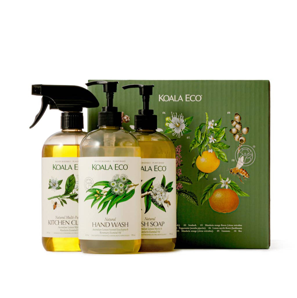 A set of Koala Eco cleaning products including hand wash, dish soap, and multi-purpose cleaner, presented in a botanical-themed packaging.