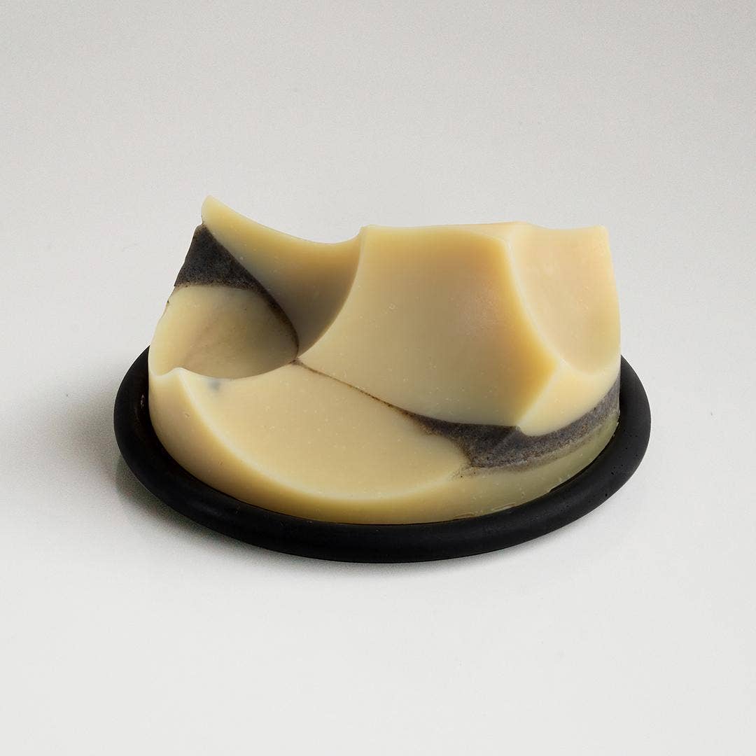 An ume studios erode soap on a black bouton. 