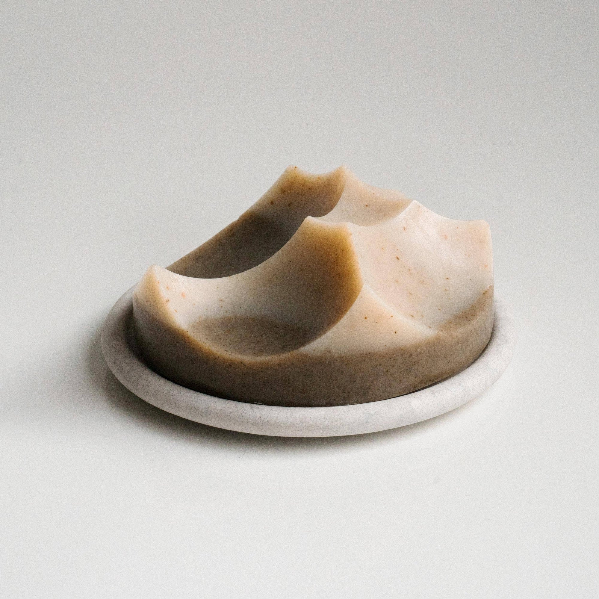 An ume studios erode soap on a marble bouton. 