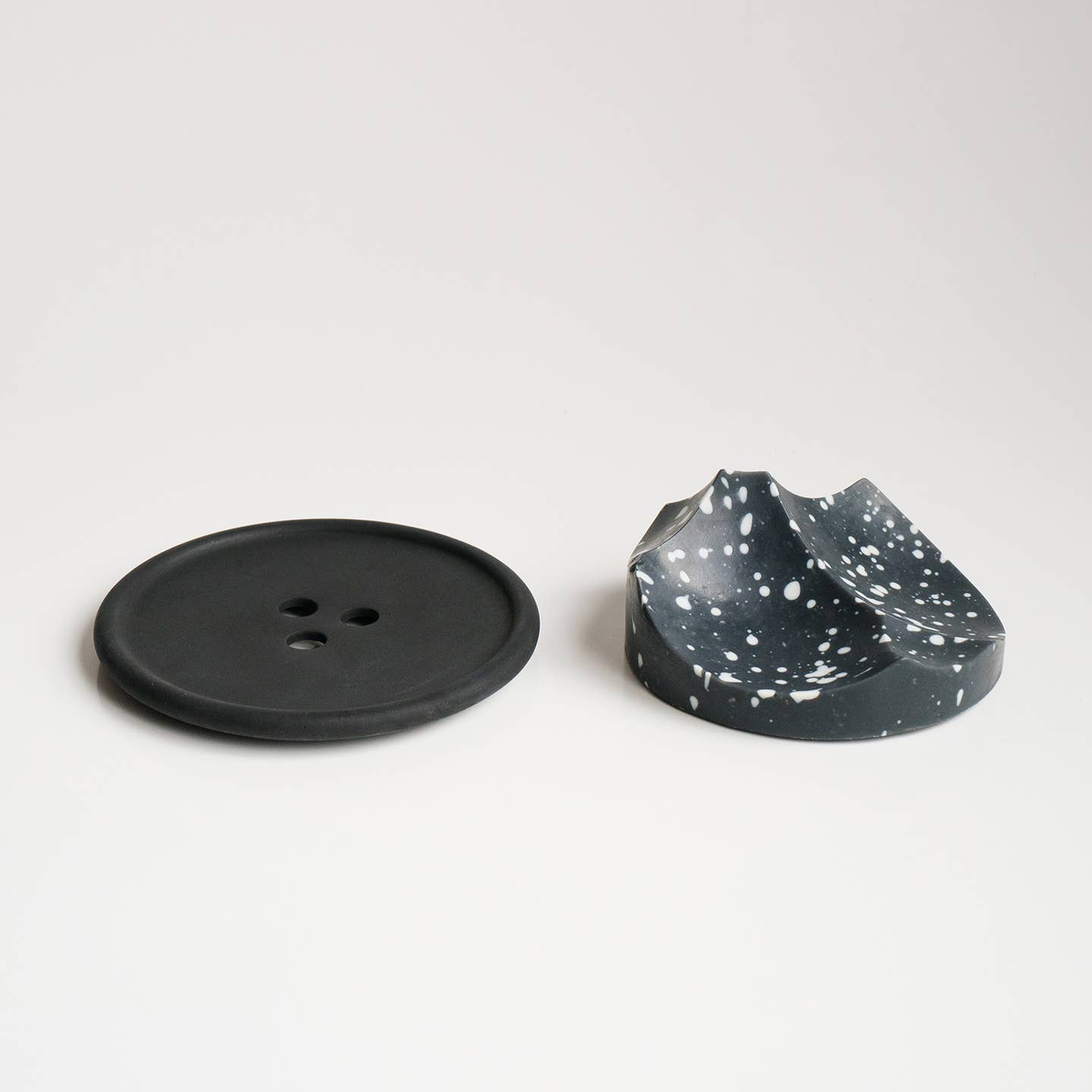 An ume studios erode soap and a black bouton. 