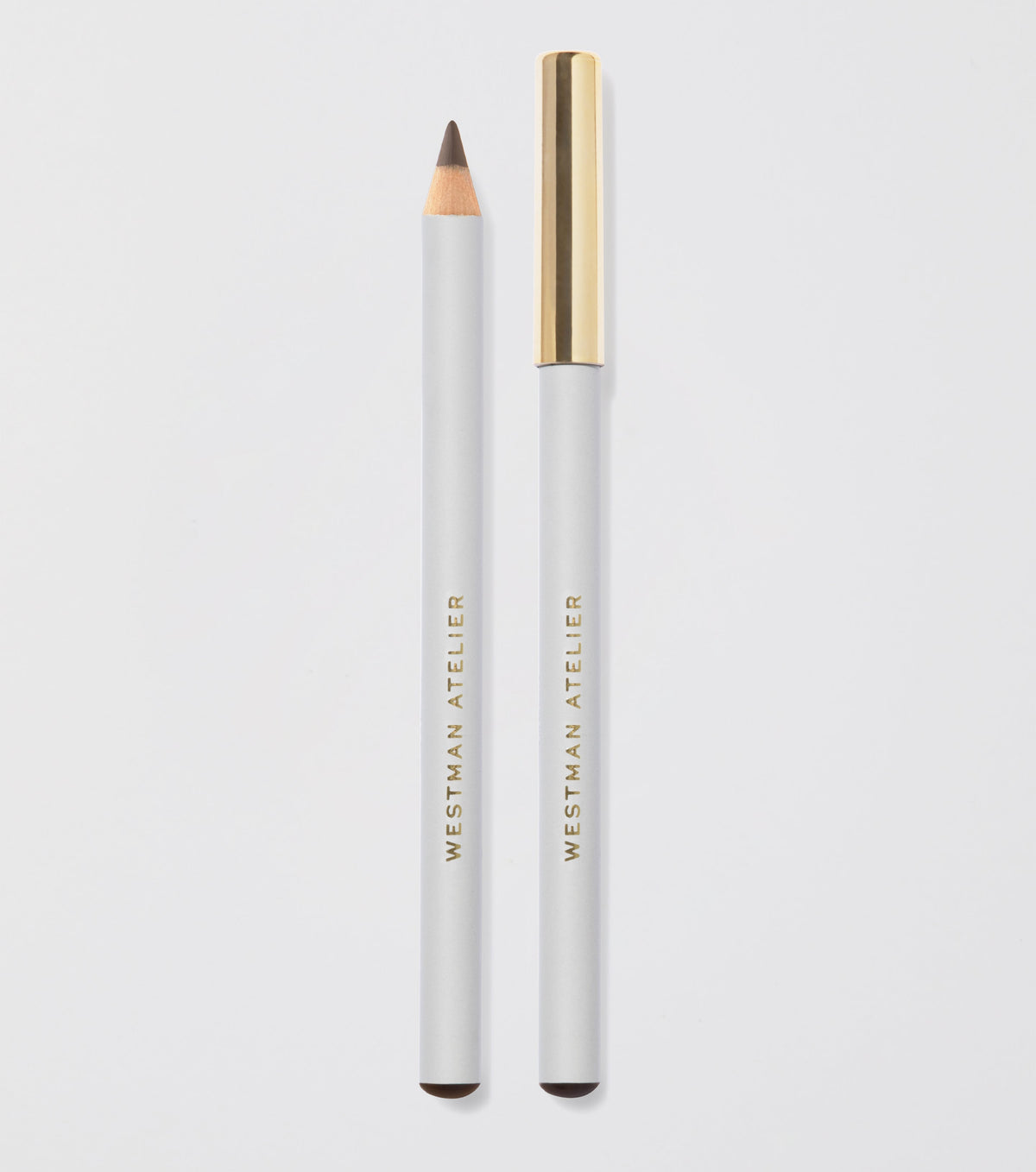 Two eye pencils from Westman Atelier, one sharpened, one not, against a white background with the brand name visible on each pencil.