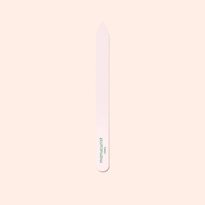 Nail file with 'Manicurist' branding on a light pink background