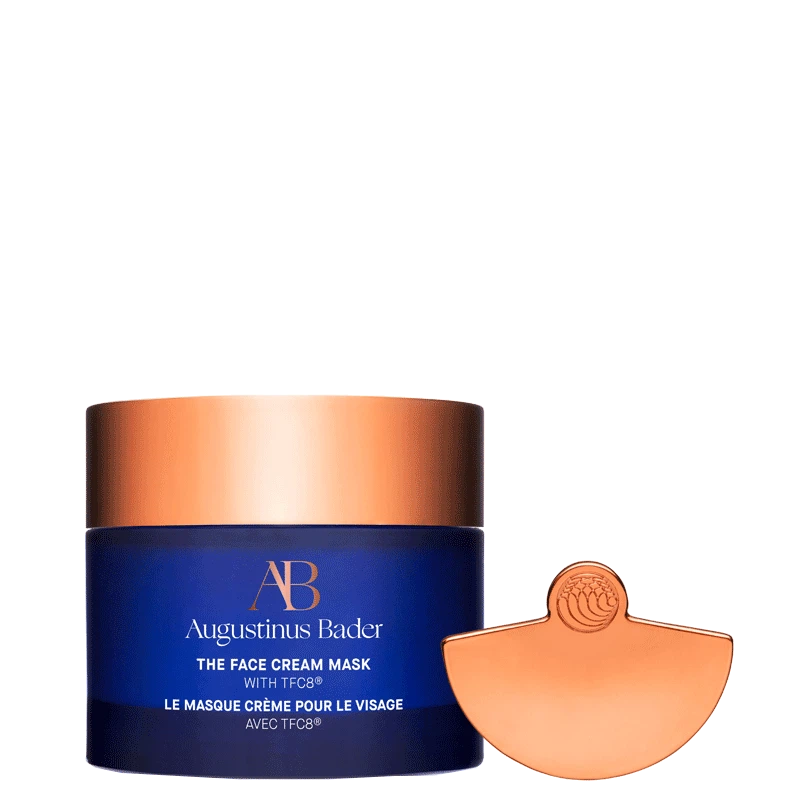 Augustinus Bader face cream mask with blue container and bronze lid on a white background