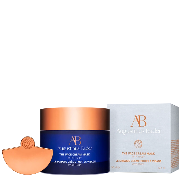 Augustinus Bader face cream mask with blue container and bronze lid on a white background