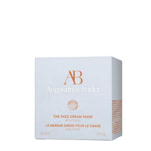 A white box of The Face Cream Mask with orange text