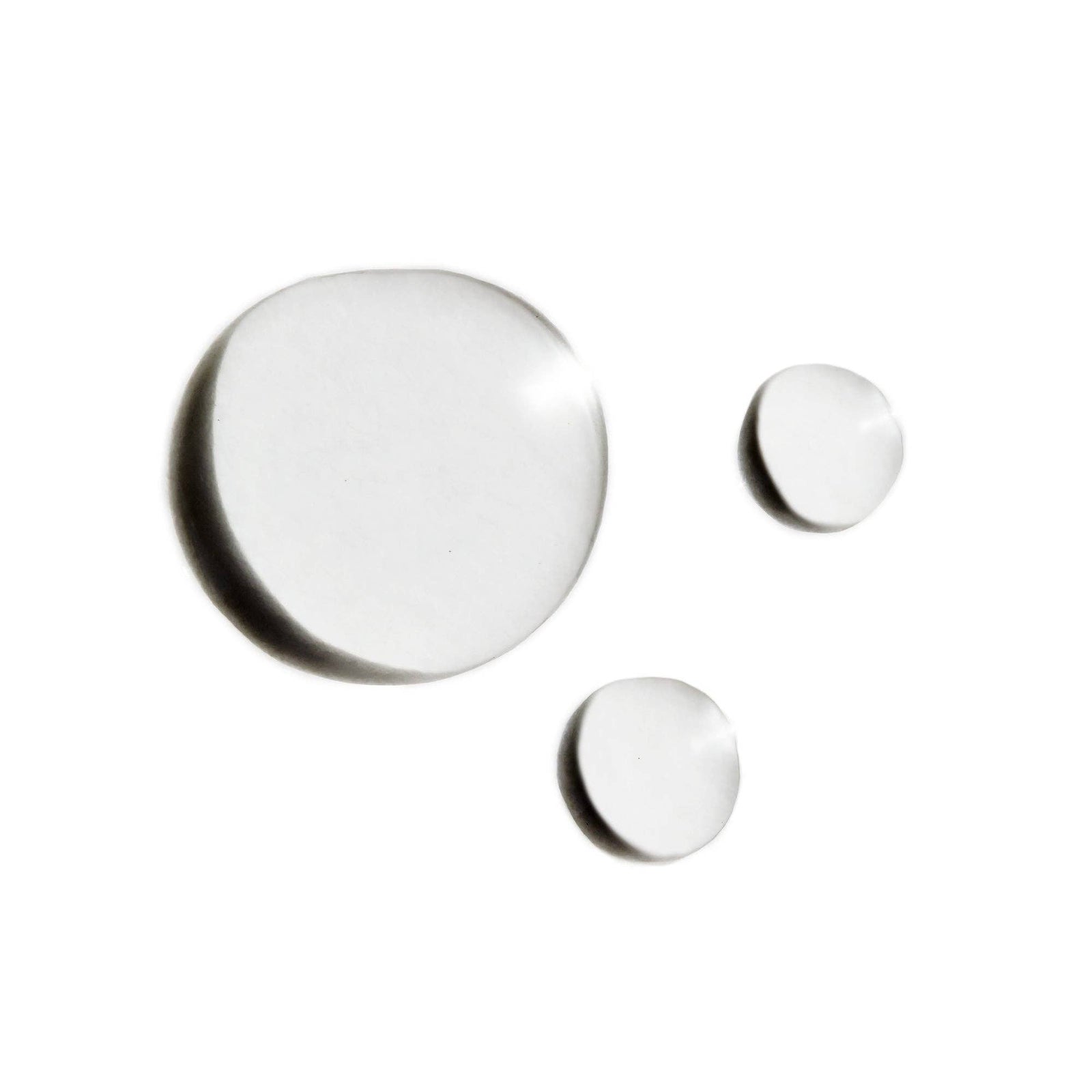 A bottle of Indie Lee Squalane Facial Oil with a white label and cap, contained in a clear glass bottle with a dropper.