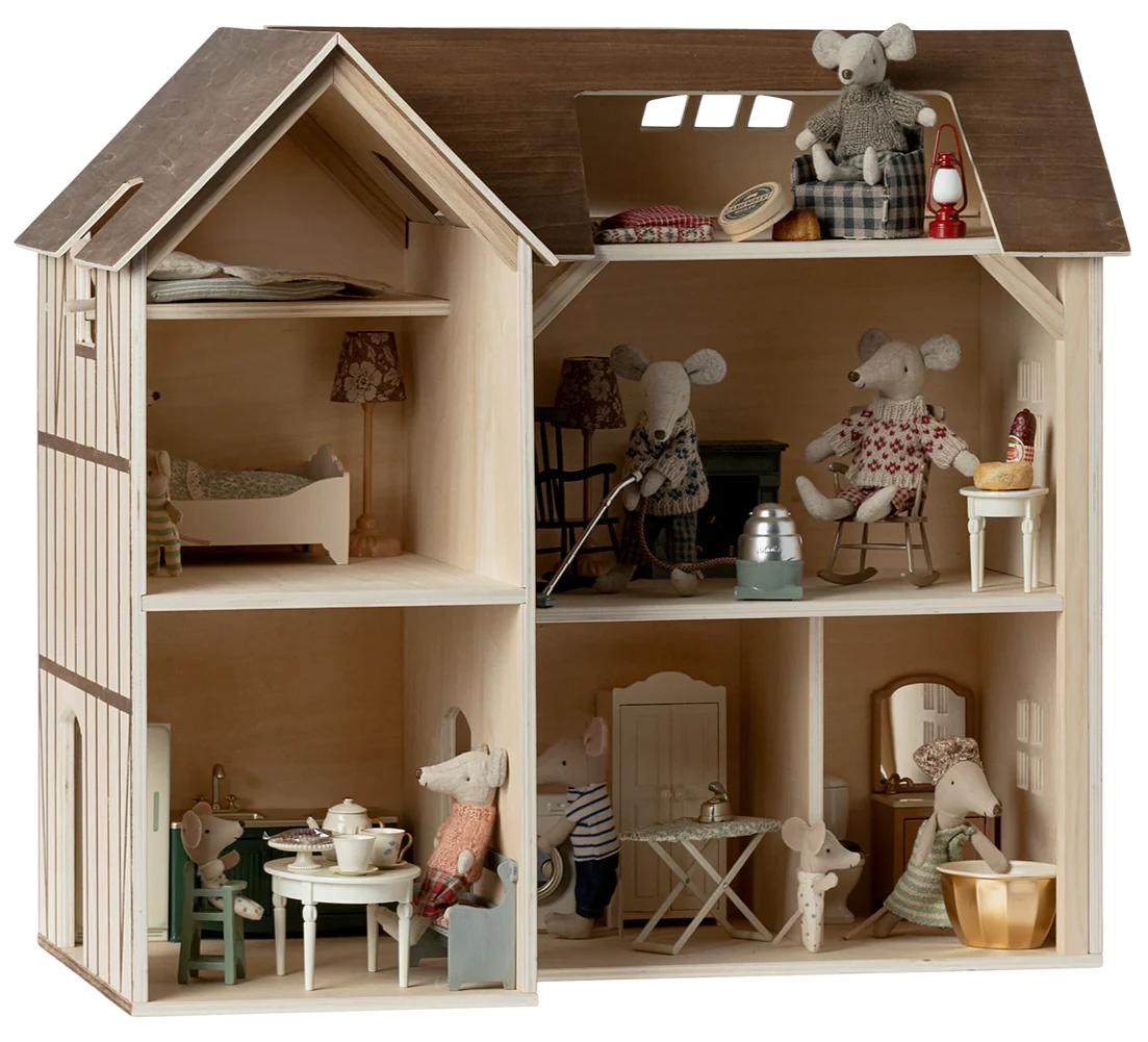 Wooden dollhouse with miniature furniture and toys inside