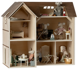 Wooden dollhouse with miniature furniture and toys inside