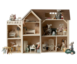 Wooden dollhouse with miniature furniture and toy mice