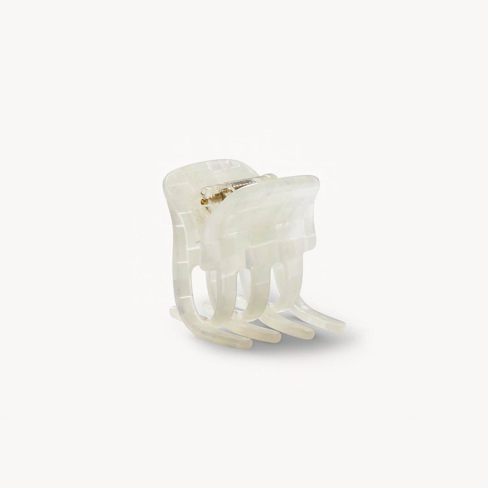 White ring with a beaded design on a white background