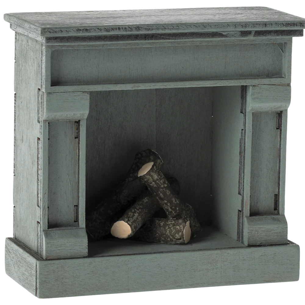 A small, toy-scale wooden fireplace with a vintage finish in blue color, featuring a log inside.