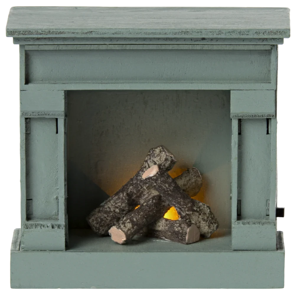A small, toy-scale wooden fireplace with a vintage finish in blue color, featuring a log inside.