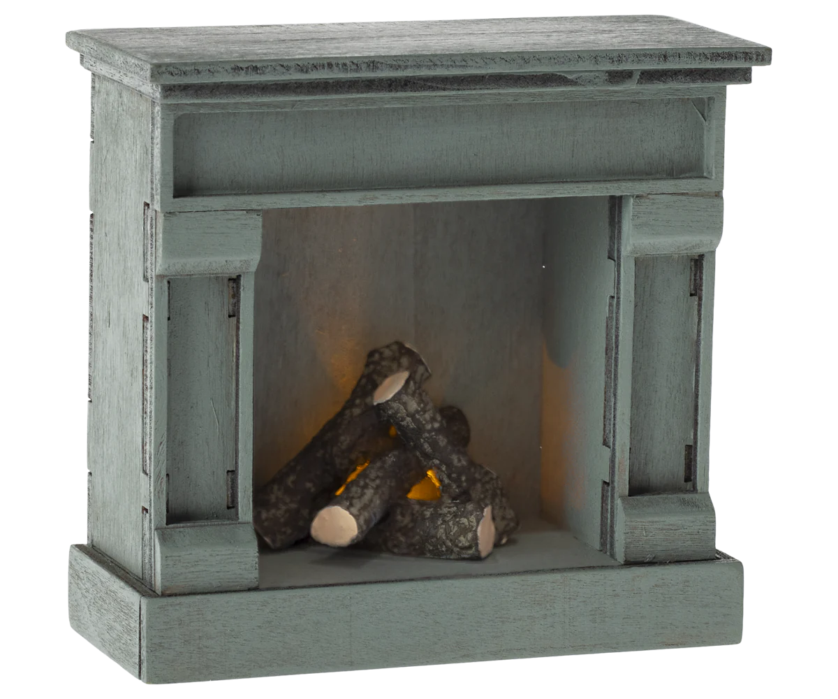 Small wooden fireplace with logs inside on a white background