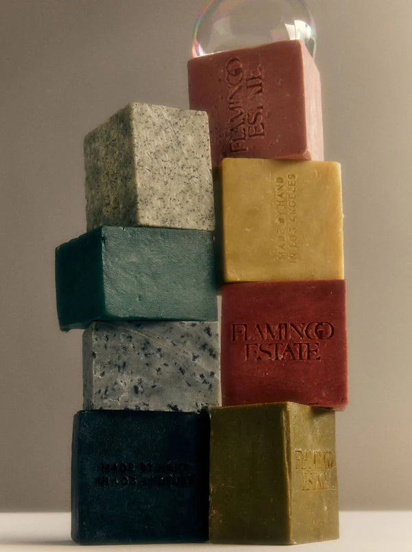 A stack of colorful Flamingo Estate Soap Bricks