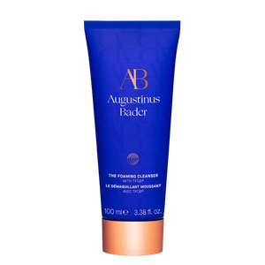 Blue tube of Augustinus Bader foaming cleanser on a white background