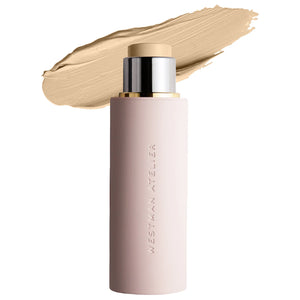 Cosmetic stick with beige color swatch on a white background, featuring the brand 'Westman Atelier'.