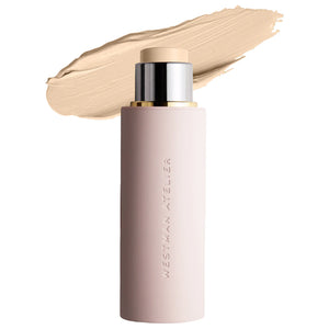 Cosmetic stick with beige color swatch on a white background, featuring the brand 'Westman Atelier'.
