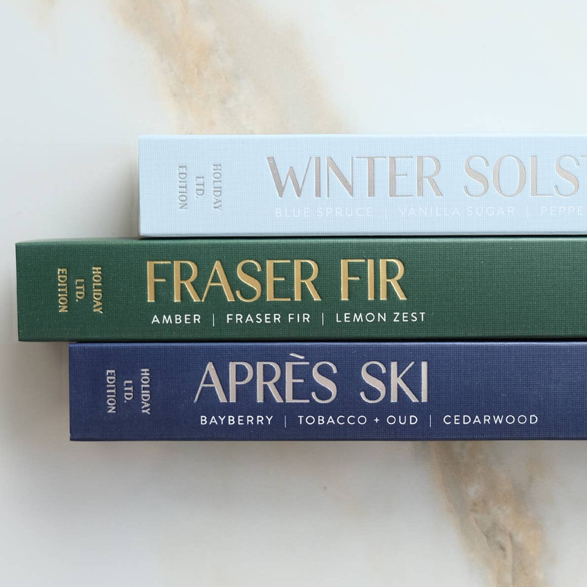 Incense sticks with a green box on a marble surface