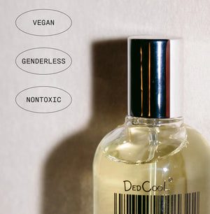 Bottle of DedCool fragrance with vegan, genderless, and nontoxic labels on a light background