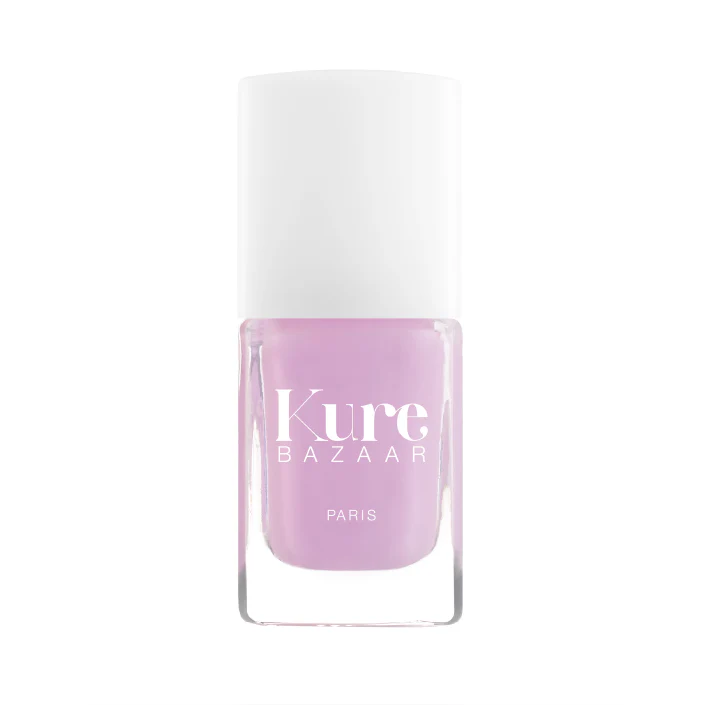 A bottle of Kure Bazaar nail polish in a lavender shade with a metallic finish, displayed against a white background.
