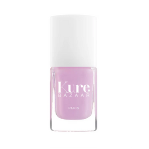 A bottle of Kure Bazaar nail polish in a lavender shade with a metallic finish, displayed against a white background.